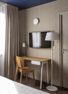 Postel nebo postele na pokoji v ubytování Hôtel Antares & Spa