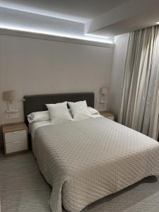 A bed or beds in a room at San Luis