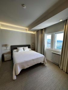 A bed or beds in a room at San Luis