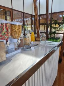 a counter with bowls and vases on it at Hotel ACA Eldorado in Eldorado