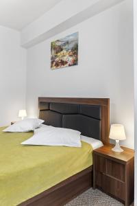 Postel nebo postele na pokoji v ubytování Lina Hotel