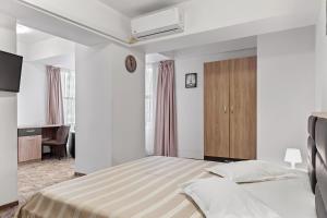 Postel nebo postele na pokoji v ubytování Lina Hotel