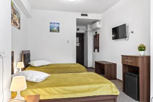 Postel nebo postele na pokoji v ubytování Lina Hotel