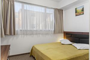 Postel nebo postele na pokoji v ubytování Lina Hotel