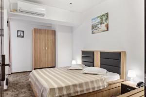 Postel nebo postele na pokoji v ubytování Lina Hotel