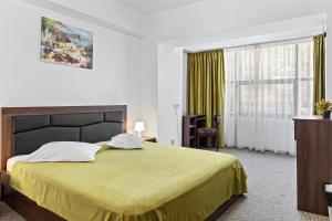 Postel nebo postele na pokoji v ubytování Lina Hotel