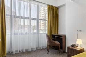 Postel nebo postele na pokoji v ubytování Lina Hotel