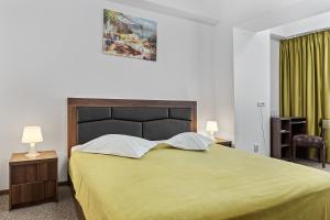 Postel nebo postele na pokoji v ubytování Lina Hotel