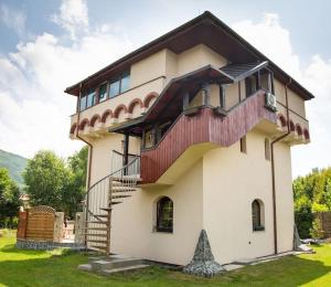 a house with a staircase on the side of it at Dream Tower in Międzybrodzie Bialskie