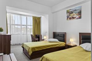Postel nebo postele na pokoji v ubytování Lina Hotel