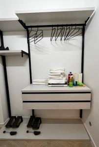 a walk in closet with black and white shelves at Central Suite 81 in Pescara