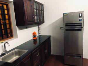 Kuchyň nebo kuchyňský kout v ubytování Garuda Suites + 24 fotografií