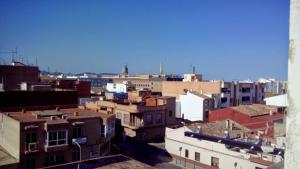 vistas a los tejados de los edificios de una ciudad en Piso compartido cerca de la UNIVERSIDAD CEU, en Moncada