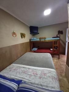 Katil atau katil-katil dalam bilik di Hospedar