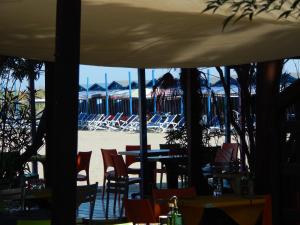 a view of a restaurant with chairs and tables at Ada home in Venice