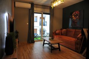 a living room with a couch and a table at Apartman Ljubica in Vrnjačka Banja