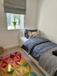 a bedroom with a bed and a window at Luxury Apartments - MBS Lettings in Bewdley