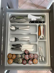 a drawer full of utensils in a refrigerator at Casa Maya in Sarnano