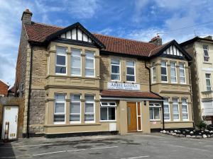 a large brick building with aania junior at Abbie Lodge Guest House in Weston-super-Mare
