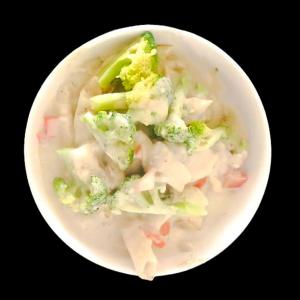 a bowl of soup with broccoli and other vegetables at Hotel Bakya Slot - Maraimalai Nagar in Chengalpattu