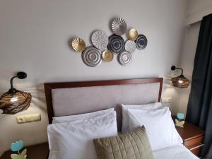 Postel nebo postele na pokoji v ubytování GreenHill Holiday Suites