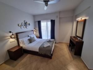 Postel nebo postele na pokoji v ubytování GreenHill Holiday Suites