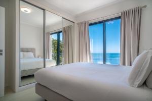 Ένα ή περισσότερα κρεβάτια σε δωμάτιο στο Coco Tangalla Villa