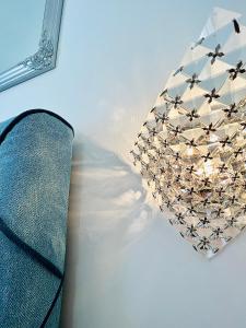 a chandelier sitting on top of a table at VILLA GIANNI dep - room VENEZIA - 4 stars in Lovran +17 photos
