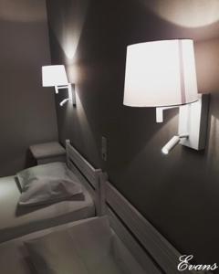 A bed or beds in a room at EVANS Skiathos