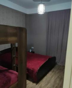 Postel nebo postele na pokoji v ubytování Didveli residenc