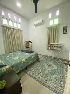 Giường trong phòng chung tại De'Laman Homestay Unit 1