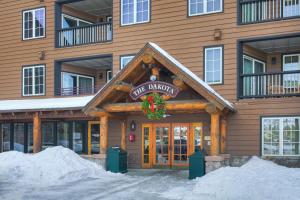 a lodge building with a christmas wreath on the door at River Run Village by Keystone Resort in Keystone