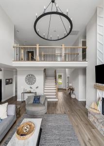 a living room with a couch and a chandelier at Lake Home Retreat w/Lake/Marina Access Golf Cart in Winchester