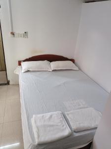 Posteľ alebo postele v izbe v ubytovaní Good Luck Hostel