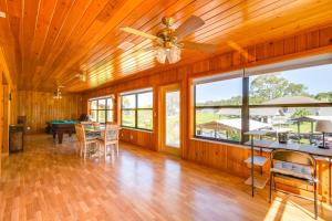 a dining room with a ceiling fan and a table at East Palatka Vacation Rental, Anglers Paradise in East Palatka