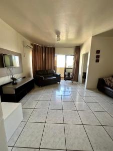 Zona de estar de Apartamento no Centro Foz do Iguaçu 130 mt