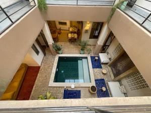 an overhead view of a swimming pool in a house at Riad Samarine in Marrakesh