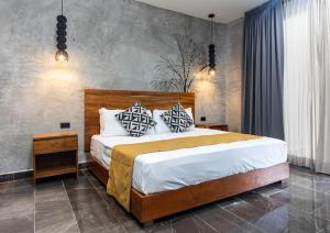 Hotel Sun Ha Bacalar房間的床