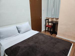 Fujima Hostel客房内的一张或多张床位