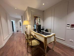 a room with a desk with a computer on it at SOL INVICTUS Boutique Hotel Durres Albania in Durrës