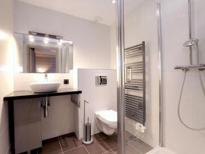 a bathroom with a toilet and a sink and a shower at Magnifique duplex 3 chambres à Courchevel avec balcon, parking, et WIFI - FR-1-575-107 in Courchevel