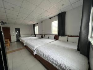 Postel nebo postele na pokoji v ubytování Hoài Thu Hotel Vũng Tàu