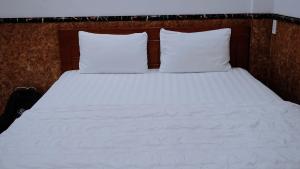 Postel nebo postele na pokoji v ubytování Hoài Thu Hotel Vũng Tàu