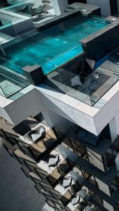 a reflection of a pool of water in a building at HO Aguadulce in Aguadulce