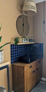 a bathroom with a sink and a mirror at Landhaus Spanier in Nonnweiler