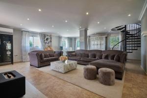 a large living room with couches and a table at Casa Blanca - Alicante in Busot