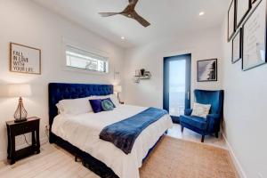 a bedroom with a blue bed and a blue chair at New Luxury Villa and Private Pool-Cart-Ocean View! in Port Aransas +46 photos