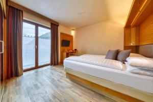 Postel nebo postele na pokoji v ubytování MOTA hotel