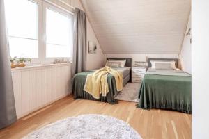 Postel nebo postele na pokoji v ubytování Schnusel Huus