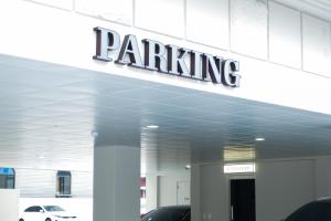 a parking garage with a sign on top of it at Aank Thepeak Hotel Incheon Songdo in Incheon